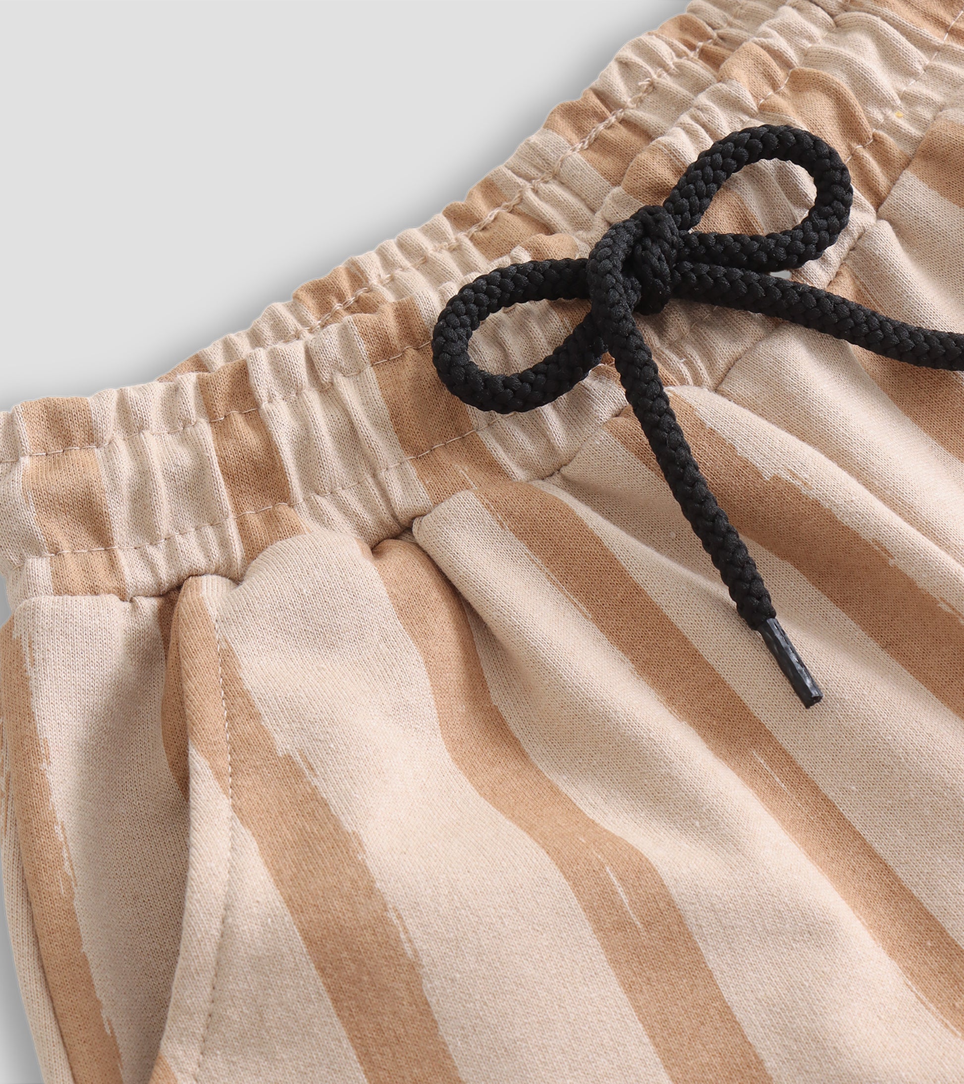 Effortless Style: Beige Striped Pants with Adjustable Rope Waist and Pockets